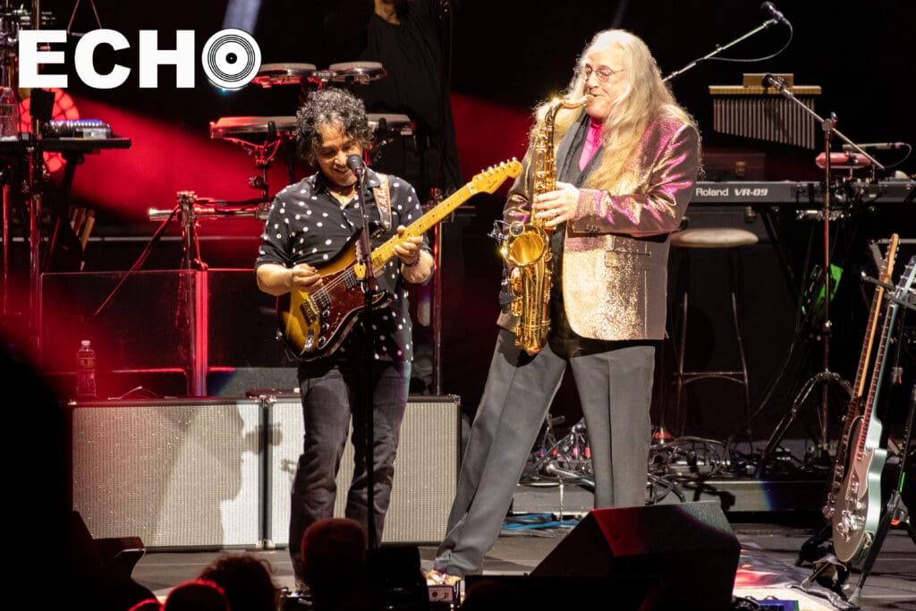 John Oates plays along to saxophone solo