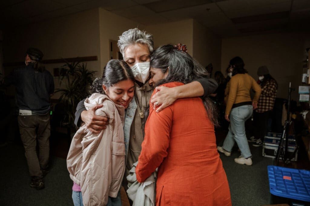 Director Fawzia hugs Nimra and Ayana on set