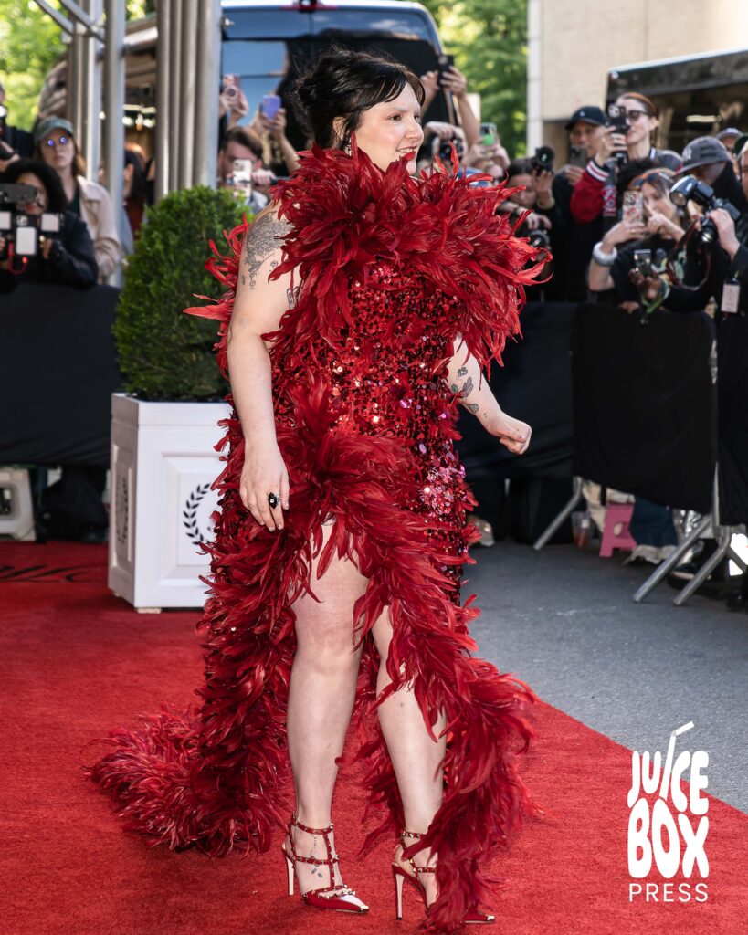 Lena Dunham poses for photos departing The Pierre Hotel for the Met Gala.