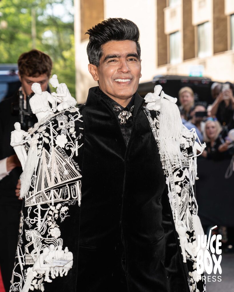 Manish Malhotra poses for photos departing The Pierre Hotel for the Met Gala.
