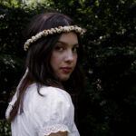 photo of Olivia Rodrigo wearing a daisy chain crown